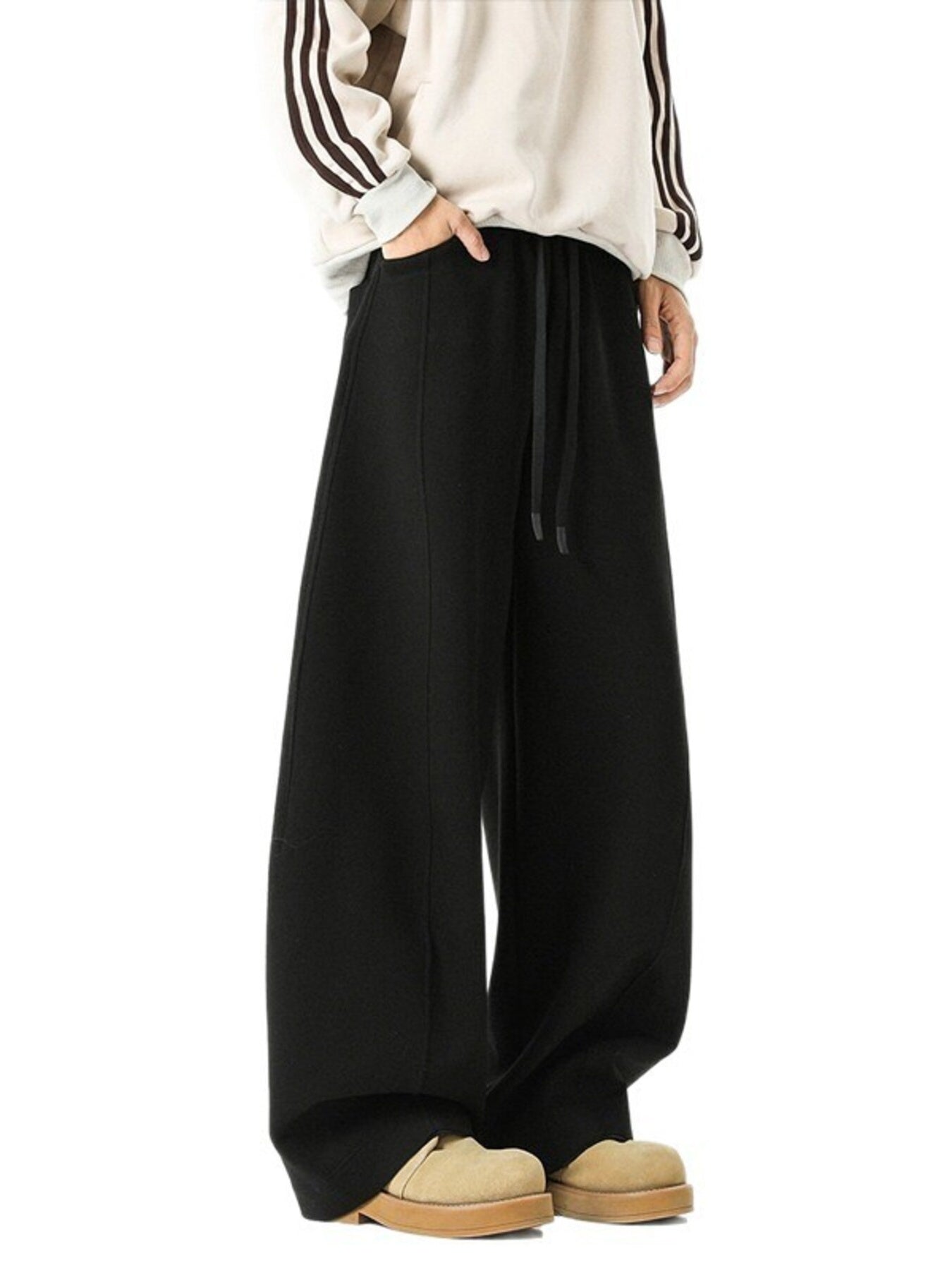 Men's black drawstring wide leg sweatpants with pockets.