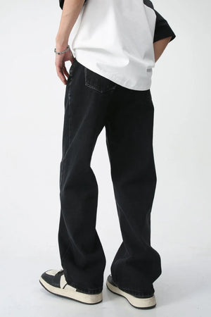 Wide-leg black denim jeans with a washed finish, shown from the back.