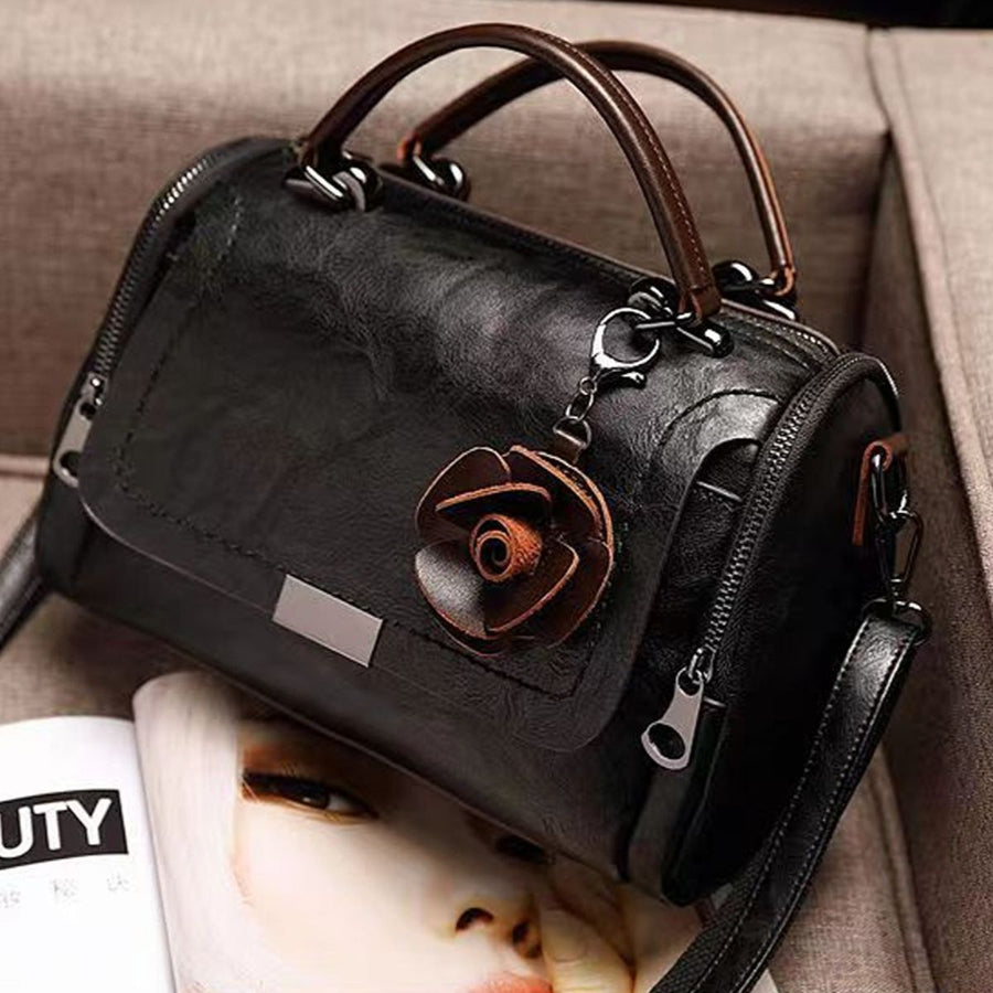 crossbody bag in Black with top handle and small