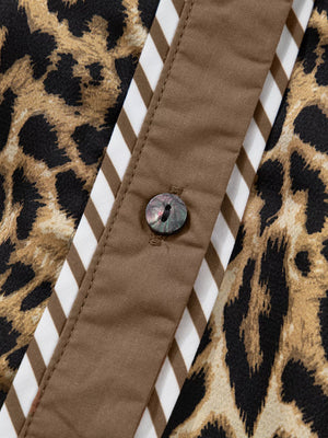 Chic leopard print two-piece set with buttoned shirt detail and striped trim.
