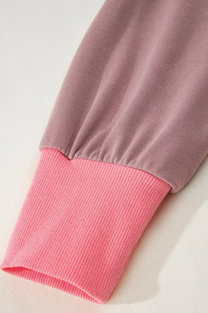 sweatshirt in hot pink with exposed seam and hip-length