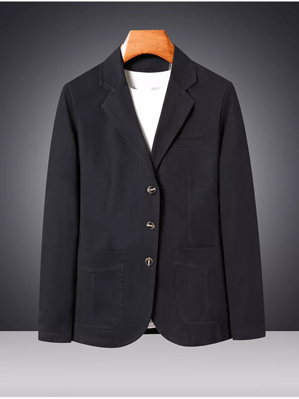 Black cotton lapel blazer for men with buttoned front and patch pockets.