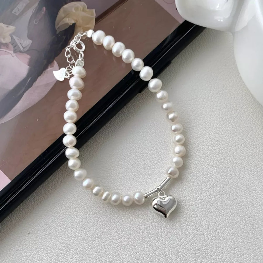 Freshwater Pearl,925 sterling silver Care instructions: Avoid wearing during exe bracelet in silver with not applicable