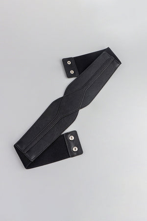 Black elastic belt with sculpted faux leather front and snap closures