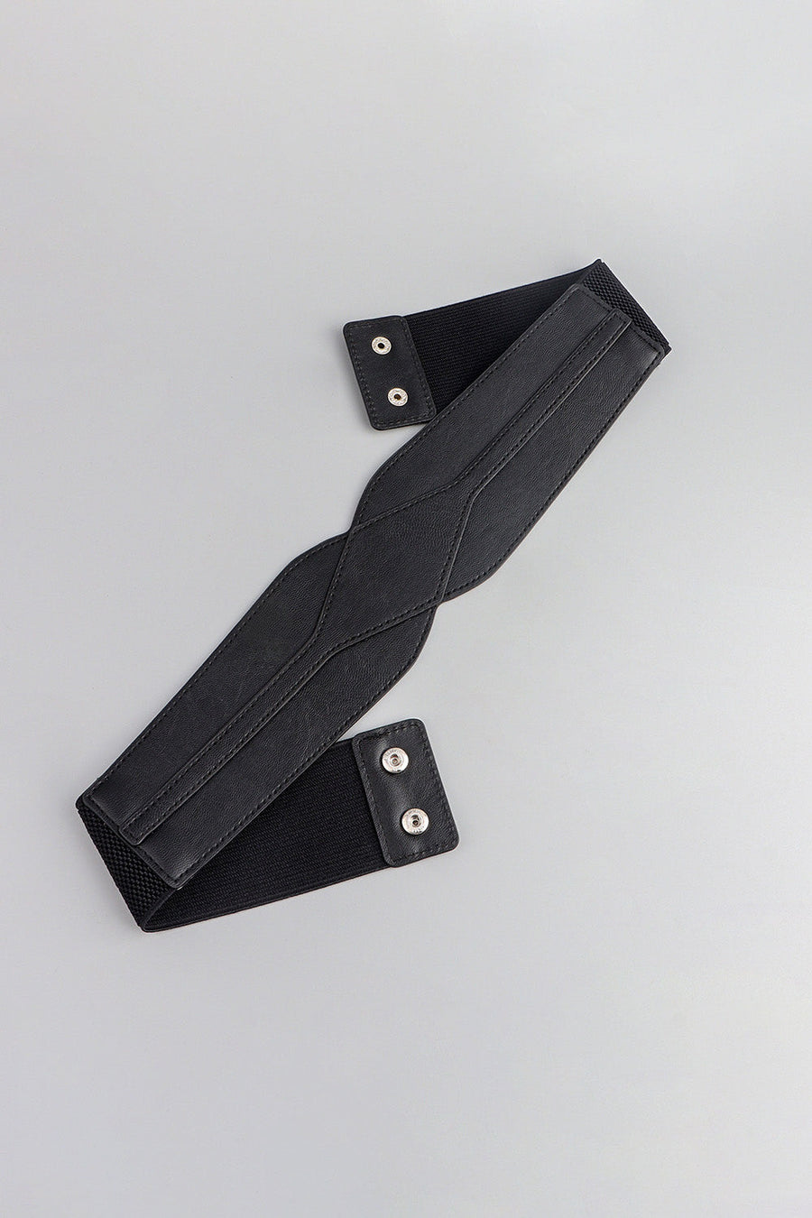 Black elastic belt with sculpted faux leather front and snap closures