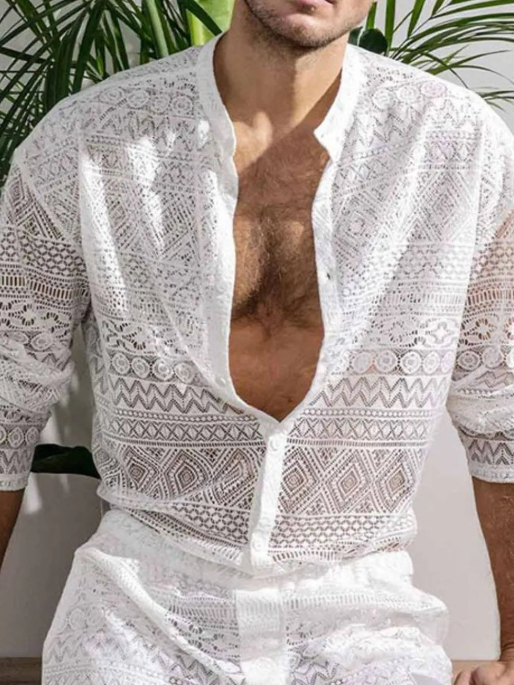 White open-weave crochet resort shirt with intricate patterns and button front.