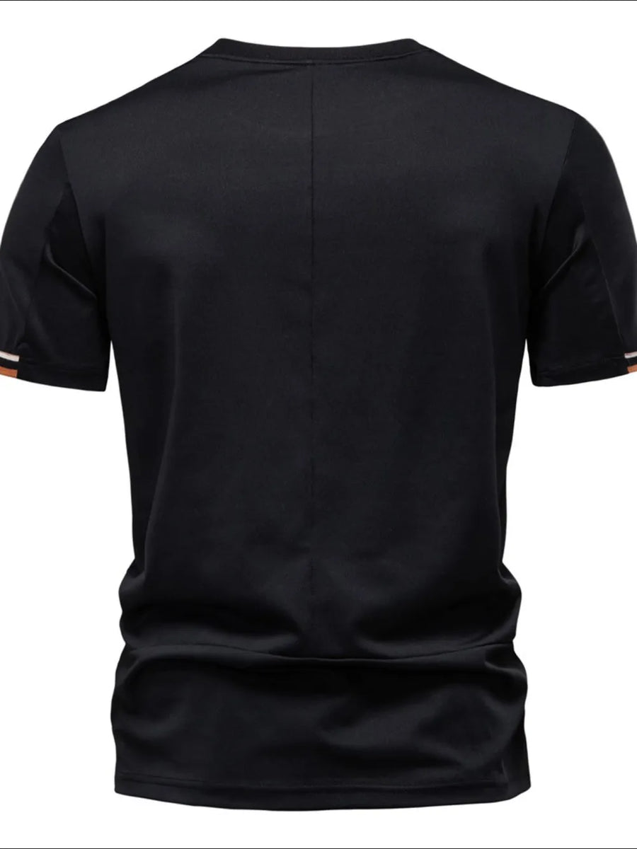 Black t-shirt with embroidered crest detail on sleeve cuff and subtle back seam.