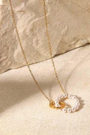 Gold-plated necklace with interlocking pearl and twisted circles pendant