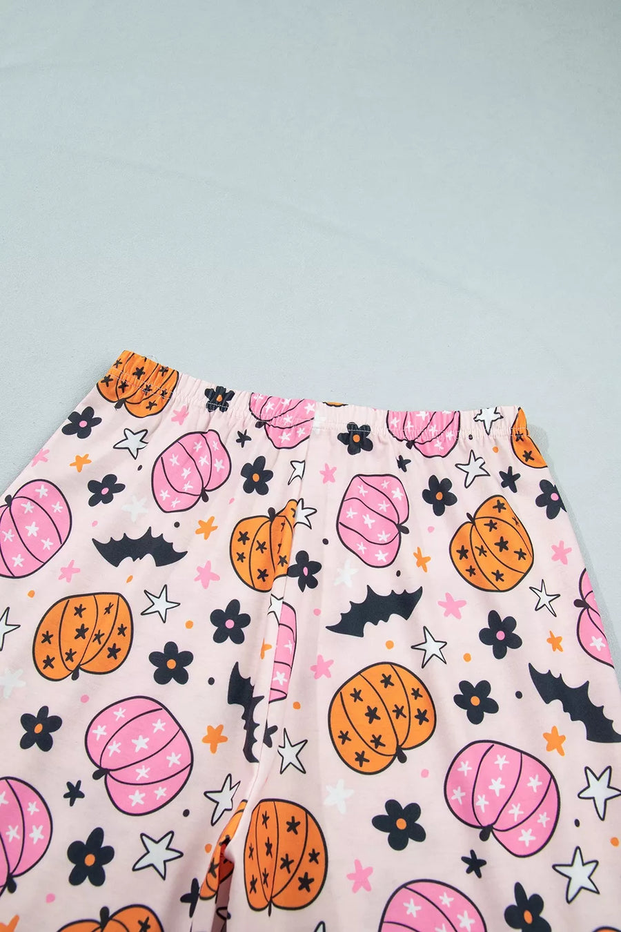 light pink pajama set with half-button and novelty print