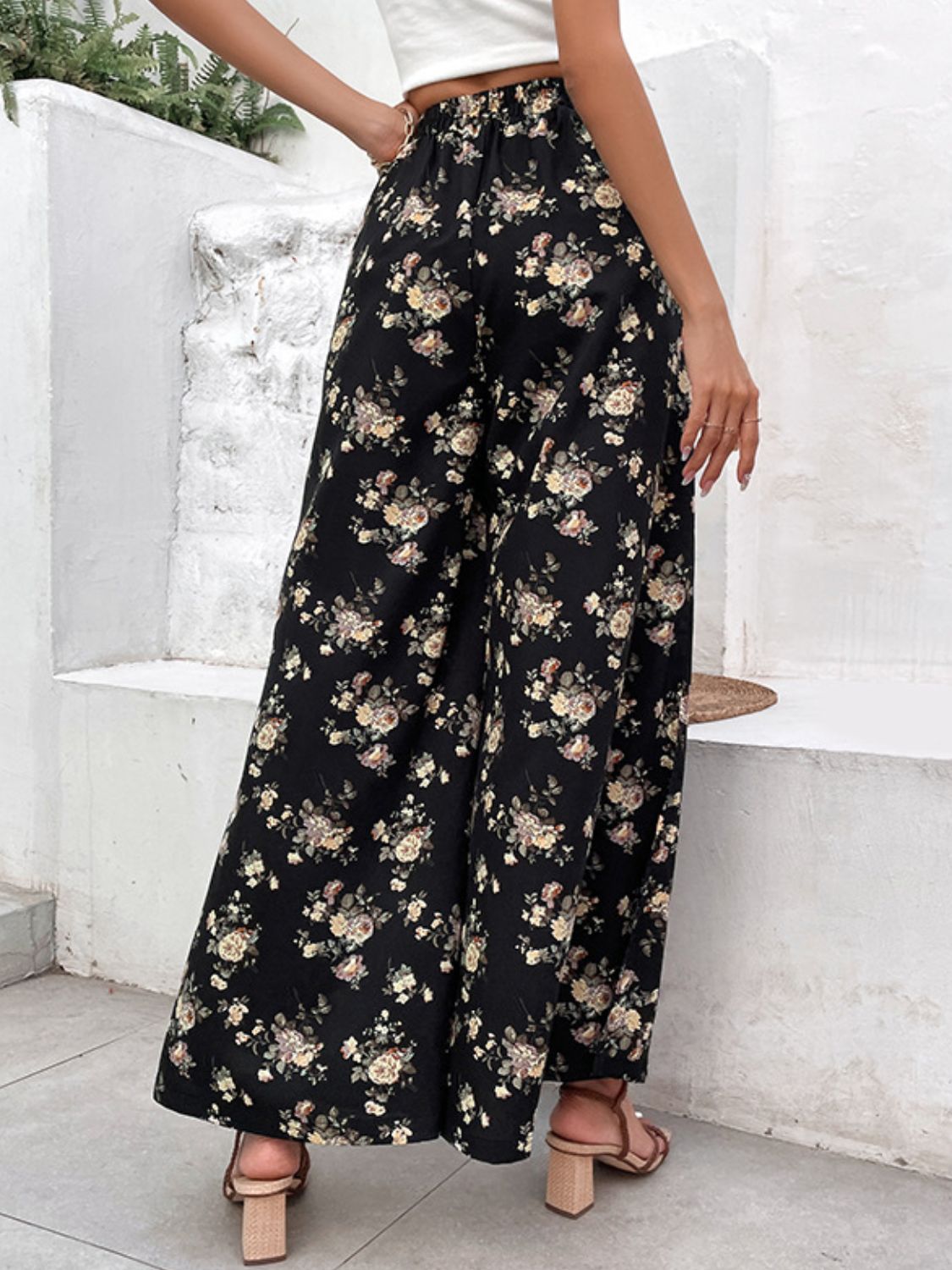Black floral palazzo trousers with split hem detail
