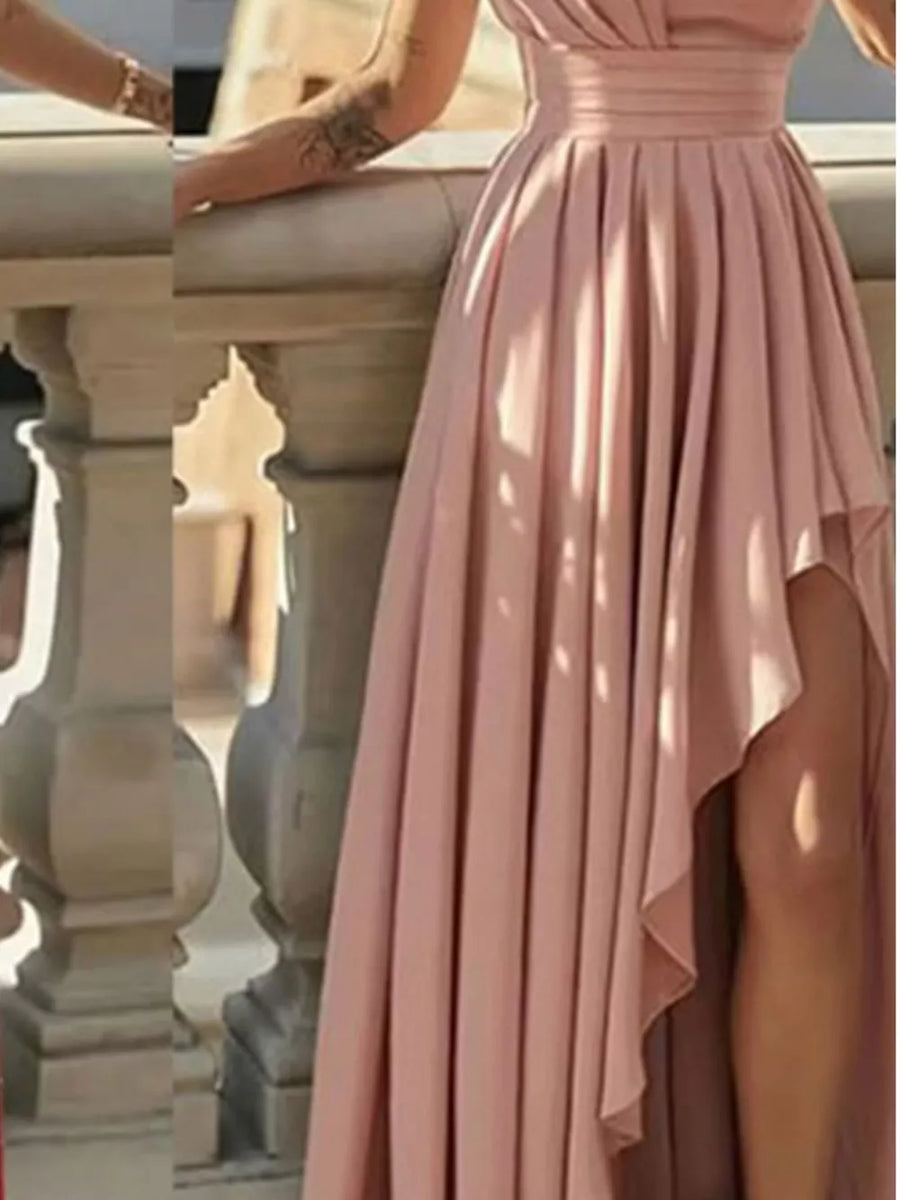Dusty pink asymmetrical hem maxi dress with cinched waist and thigh-high slit.