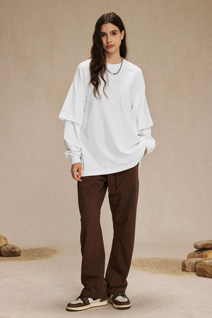 White layered long sleeve t-shirt with brown drawstring pants