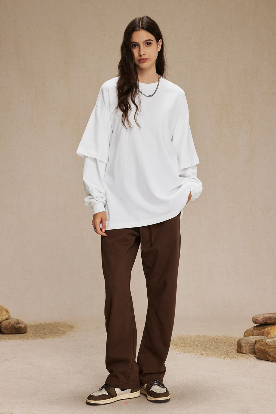 White layered long sleeve t-shirt with brown drawstring pants