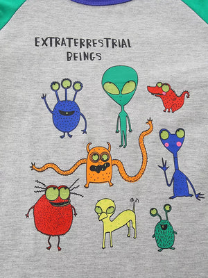 Gray t-shirt with colorful cartoon alien monsters and text.