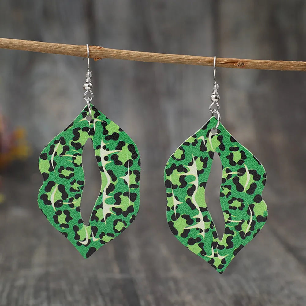 Green leopard print lip drop earrings with cutouts.