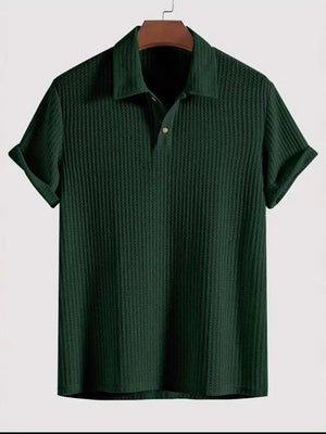 Dark green textured polo shirt with rolled sleeves and a buttoned collar.
