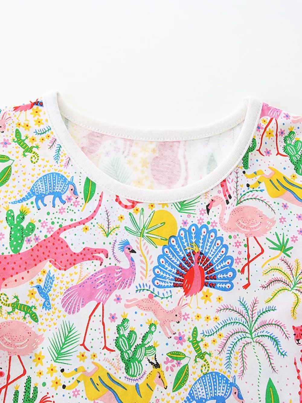 Baby dress with colorful animal and plant print, cotton blend, round neckline.
