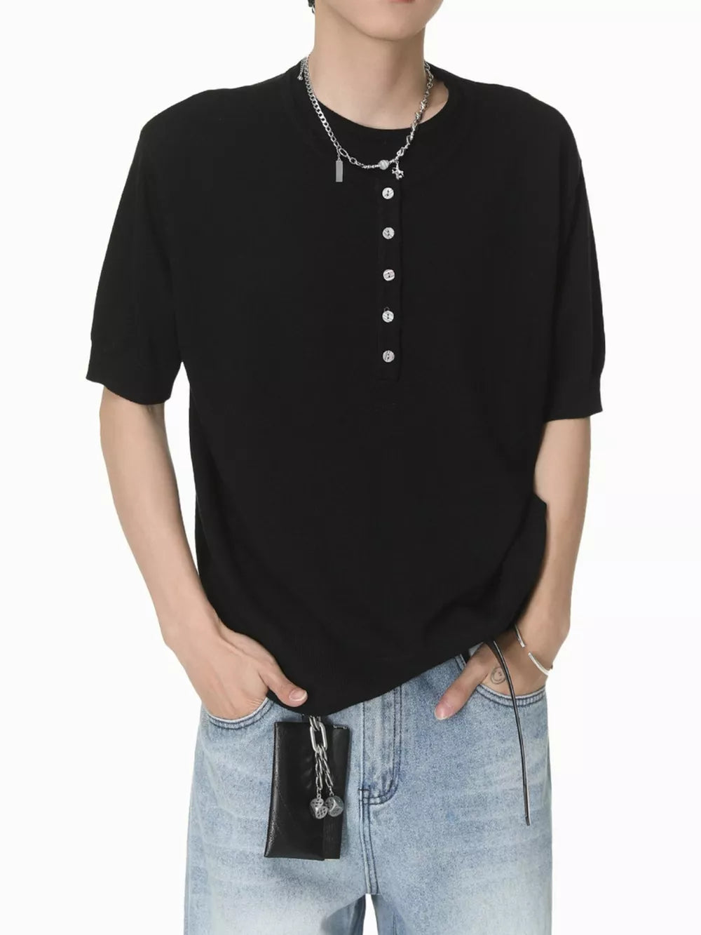 Black short sleeve henley t-shirt with button placket and crew neck.