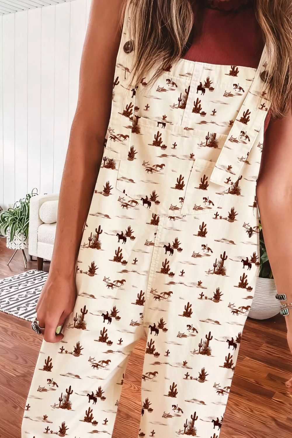 Desert motif adjustable jumpsuit in beige cotton with cactus and horse print.