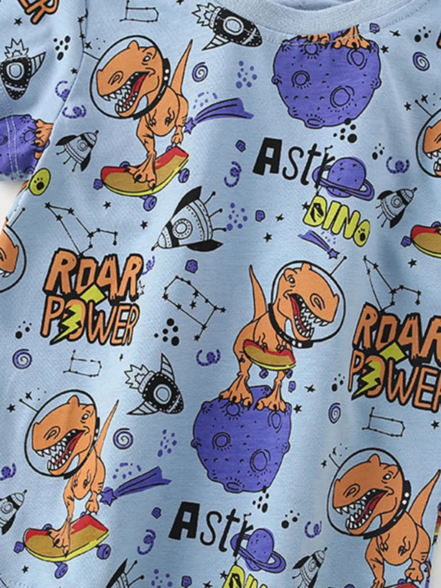 Light blue graphic t-shirt with astronaut dinosaurs, planets, and rockets.