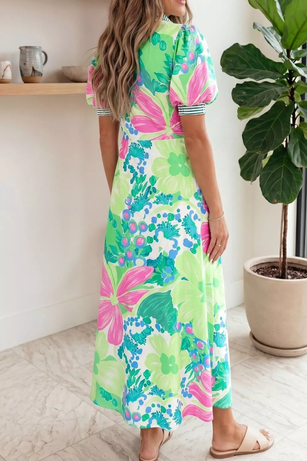 Charming floral midi dress with puff sleeves, green, pink, and blue print, white background.