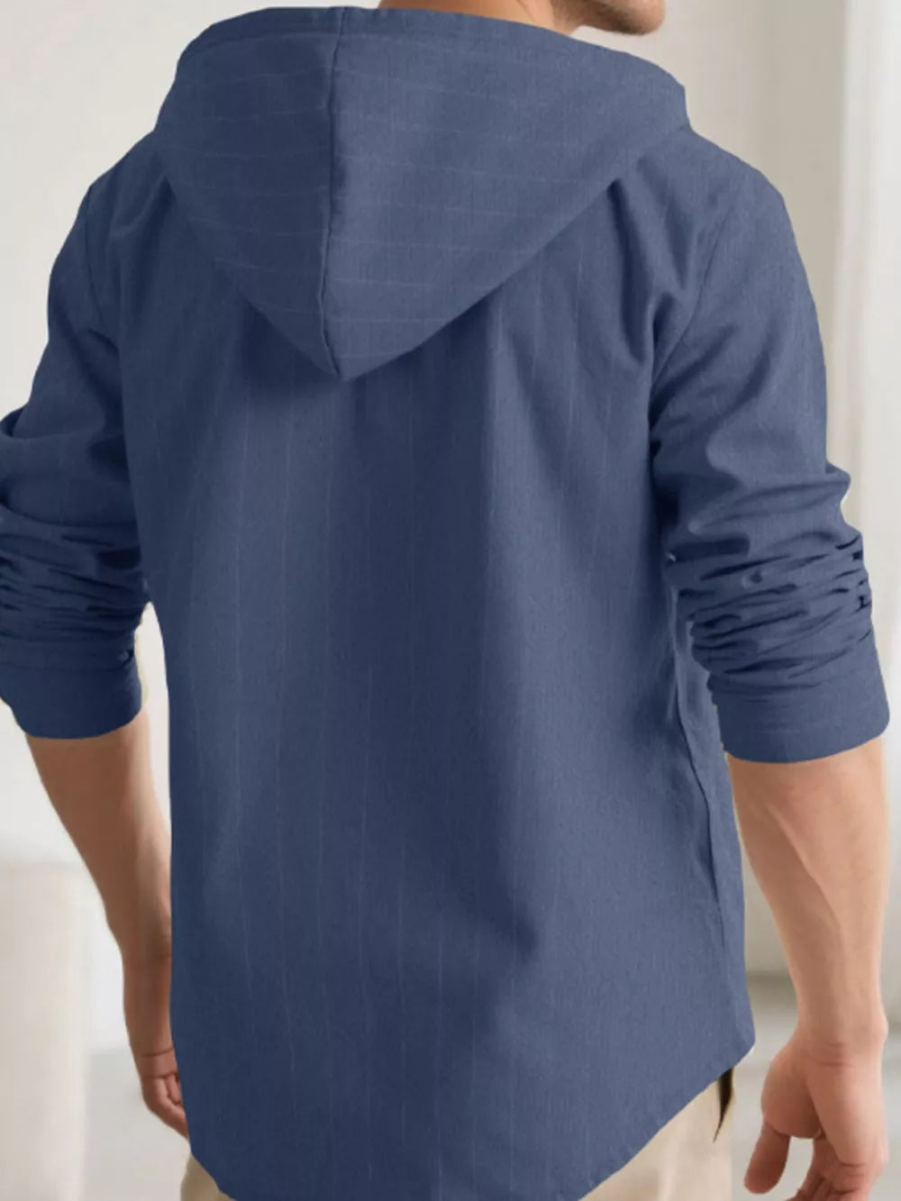 Navy blue hooded button-up shirt for men with subtle vertical pinstripe texture.
