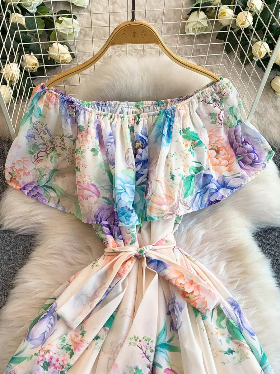 Botanical off-shoulder a-line dress with ruffled sleeves and a belted waist in light pink and purple floral print.