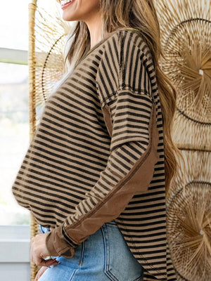 Casual drop shoulder knit top in taupe with black stripes and contrast elbow patches.