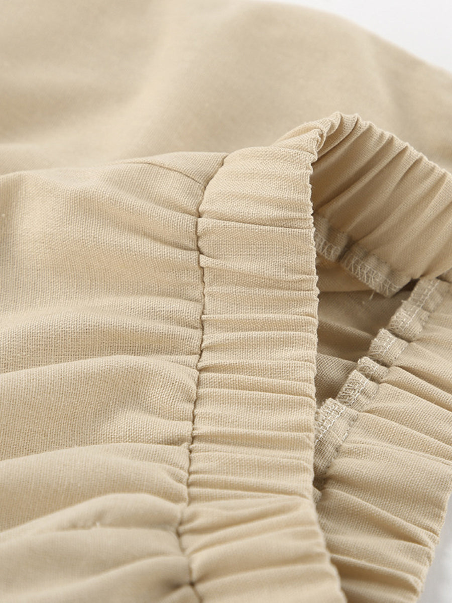 Tan cotton crop top and wide-leg pants set with ruched elastic waistband detail.
