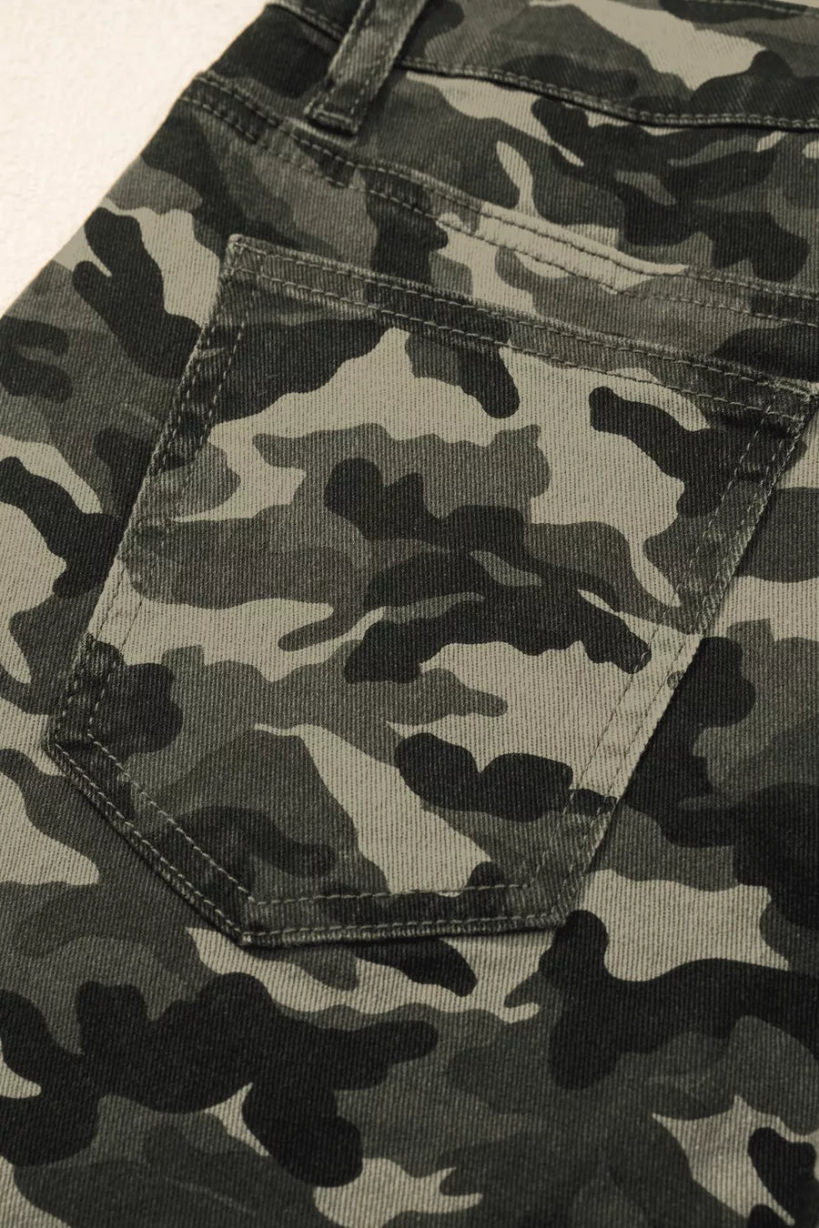 Women's camo print cotton jeans with a back pocket detail.