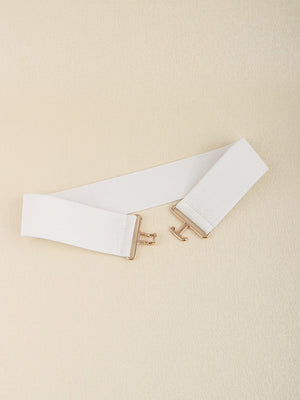 White elastic belt with gold sculpted buckle and hook closure