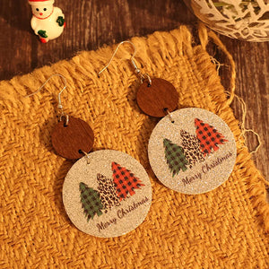 Festive tree print drop earrings with wood accent and Merry Christmas text.