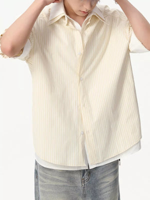 Yellow striped cotton blend button-up shirt with short sleeves and a white underlayer.
