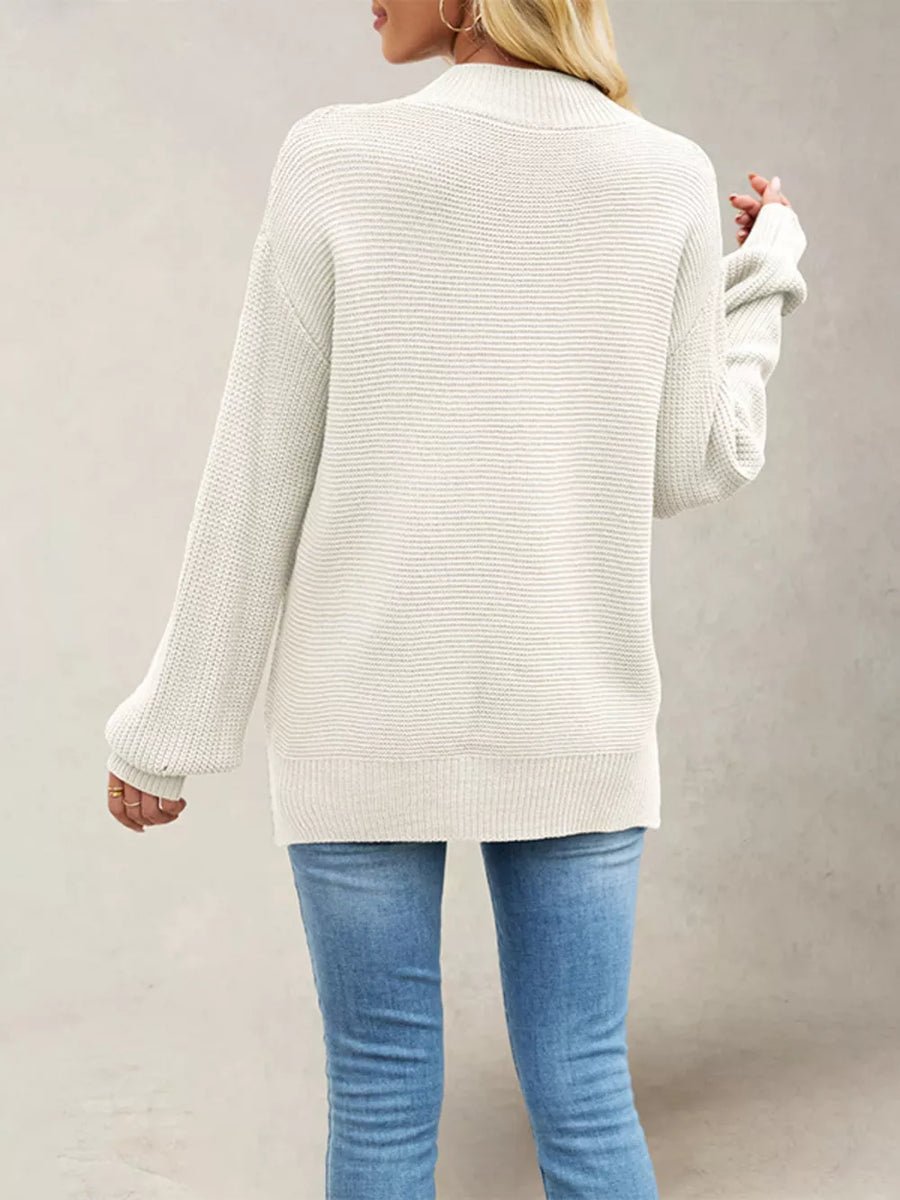 Green mock neck sweater featuring ribbed and ribbed