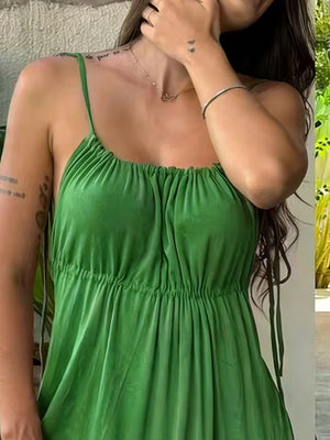 Green spaghetti strap maxi dress with drawstring waist and ruched bodice.
