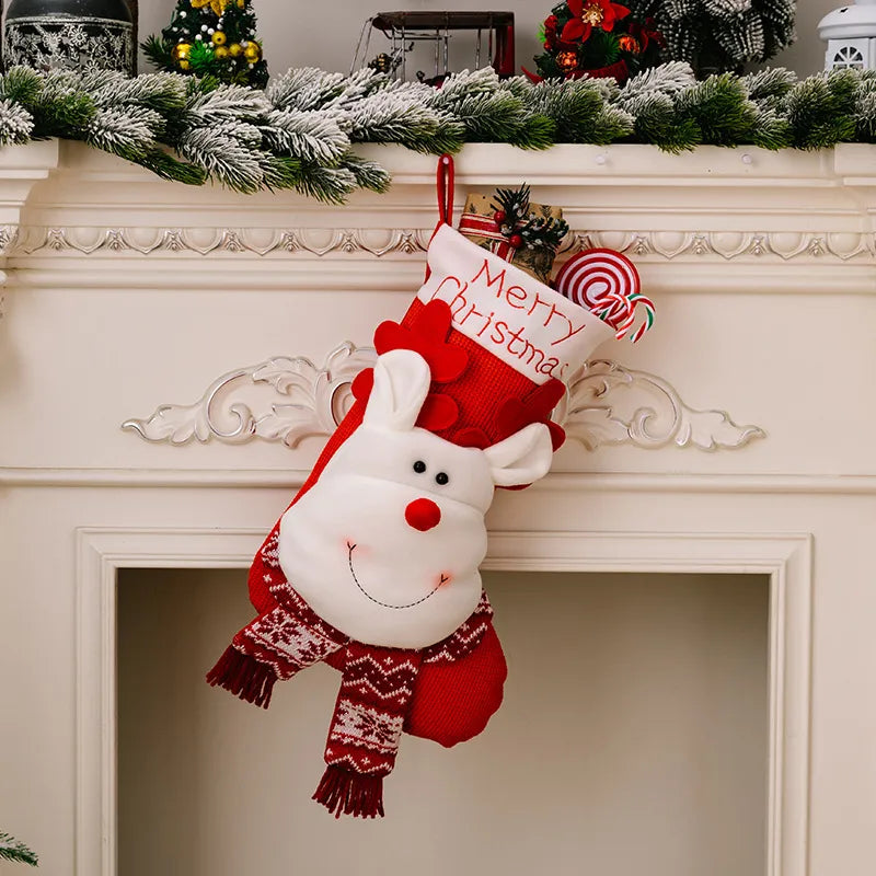 Red Christmas stocking with reindeer face, Merry Christmas text, and candy cane detail.