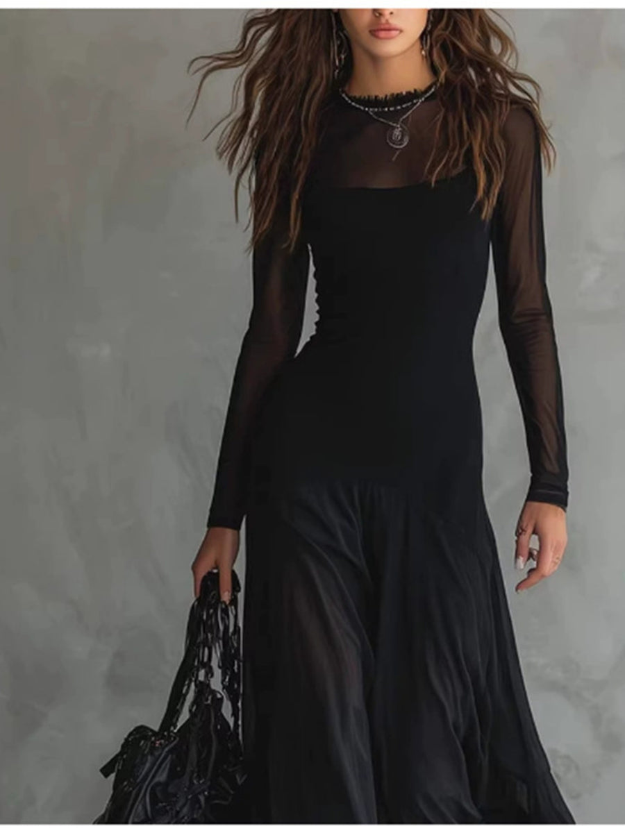 Black sheer mesh maxi dress with long sleeves and a ruffled neckline.