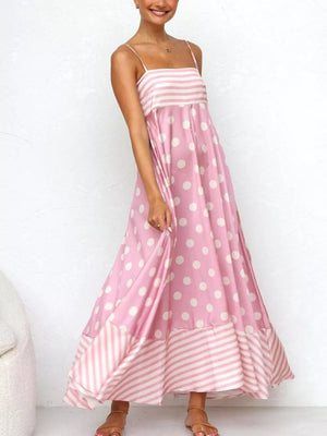 Blush pink maxi dress with spaghetti straps, polka dot print and striped hem.