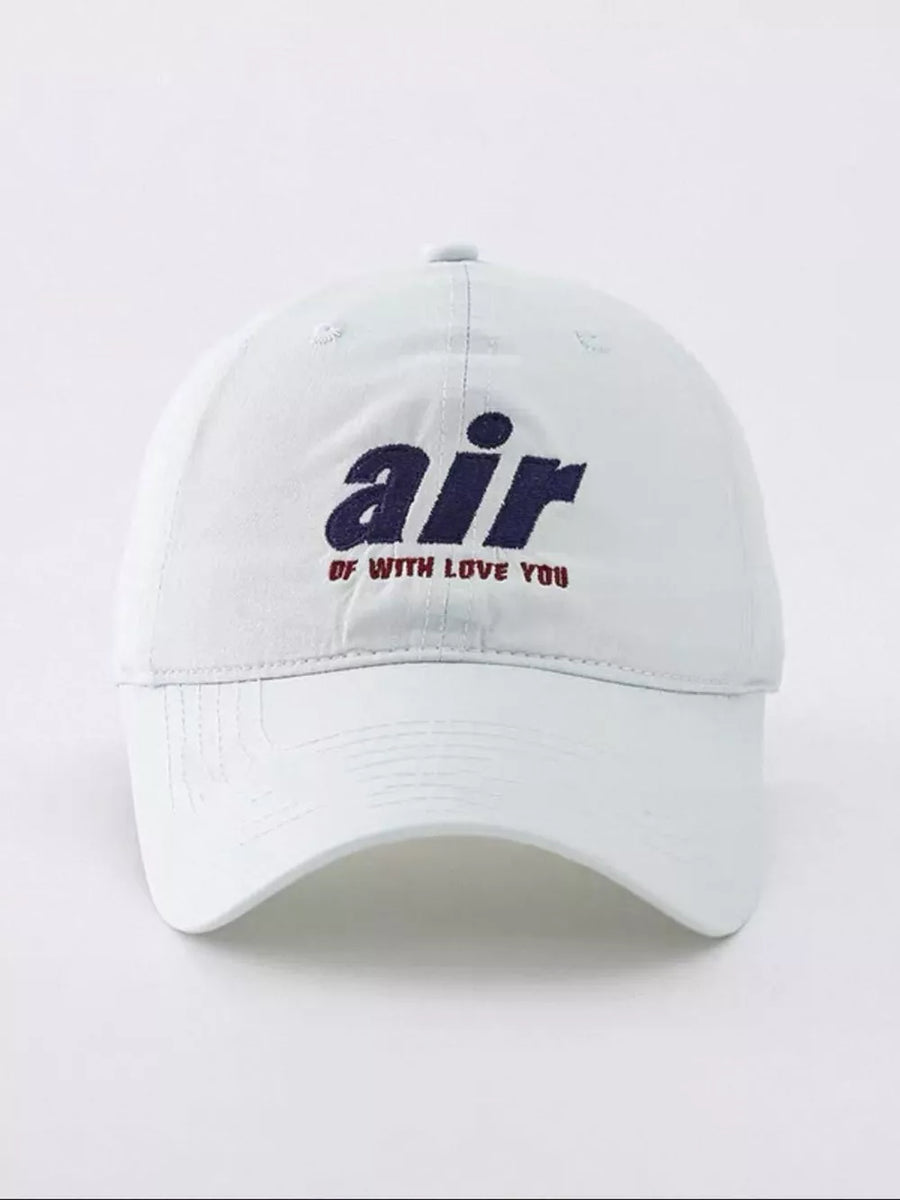 White baseball cap with embroidered "air" and "of with love you" text.