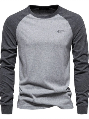 Colorblock raglan tee in gray and dark gray with a crew neck and embroidered logo.