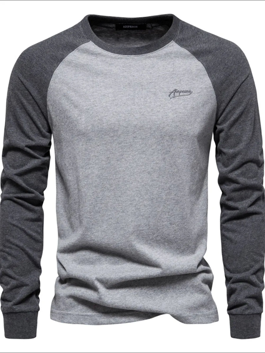 Colorblock raglan tee in gray and dark gray with a crew neck and embroidered logo.