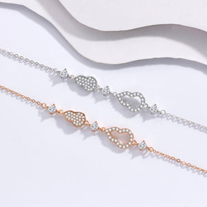 Zircon gourd charm bracelet set in rose gold and silver with adjustable chains.