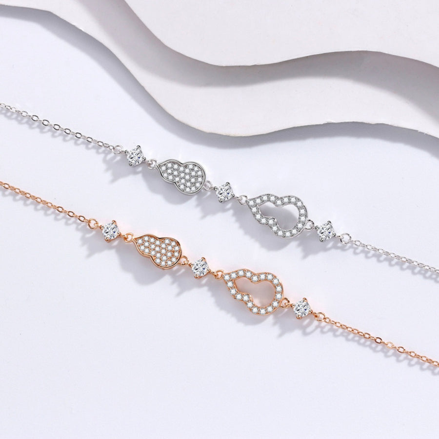 Zircon gourd charm bracelet set in rose gold and silver with adjustable chains.