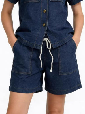 Dark blue denim button-up top and shorts set with drawstring waist and patch pockets.