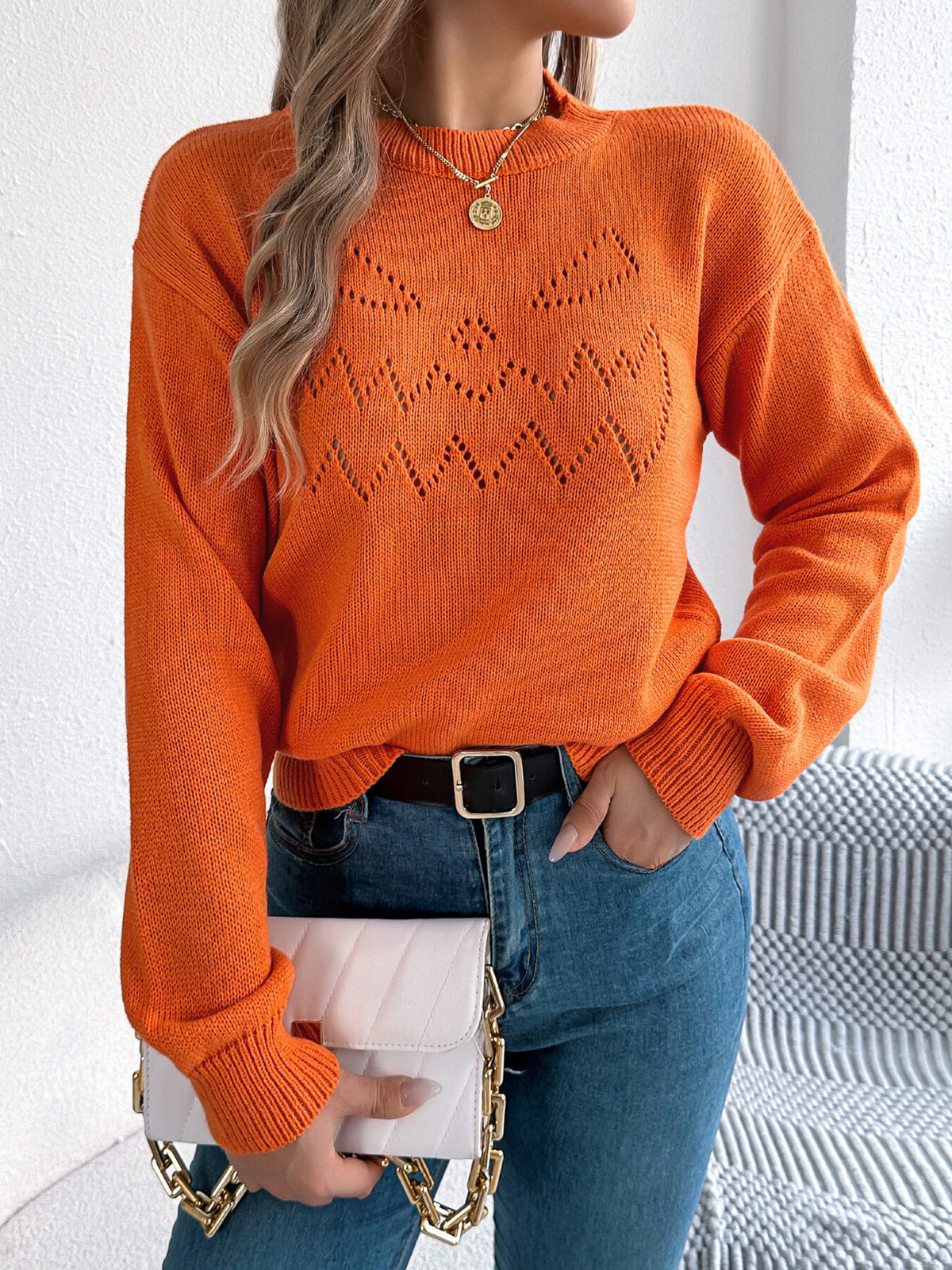 orange pullover sweater with geometric and crew neck