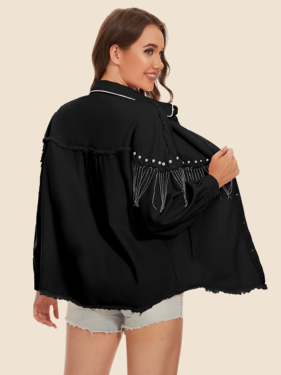 Black denim trucker jacket with fringe and pearl embellishments, frayed hem