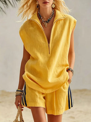 Yellow linen sleeveless zip-neck top and striped shorts set.