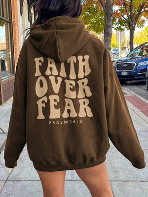 Dark brown graphic hoodie with "Faith Over Fear Psalm 56:3" text on back