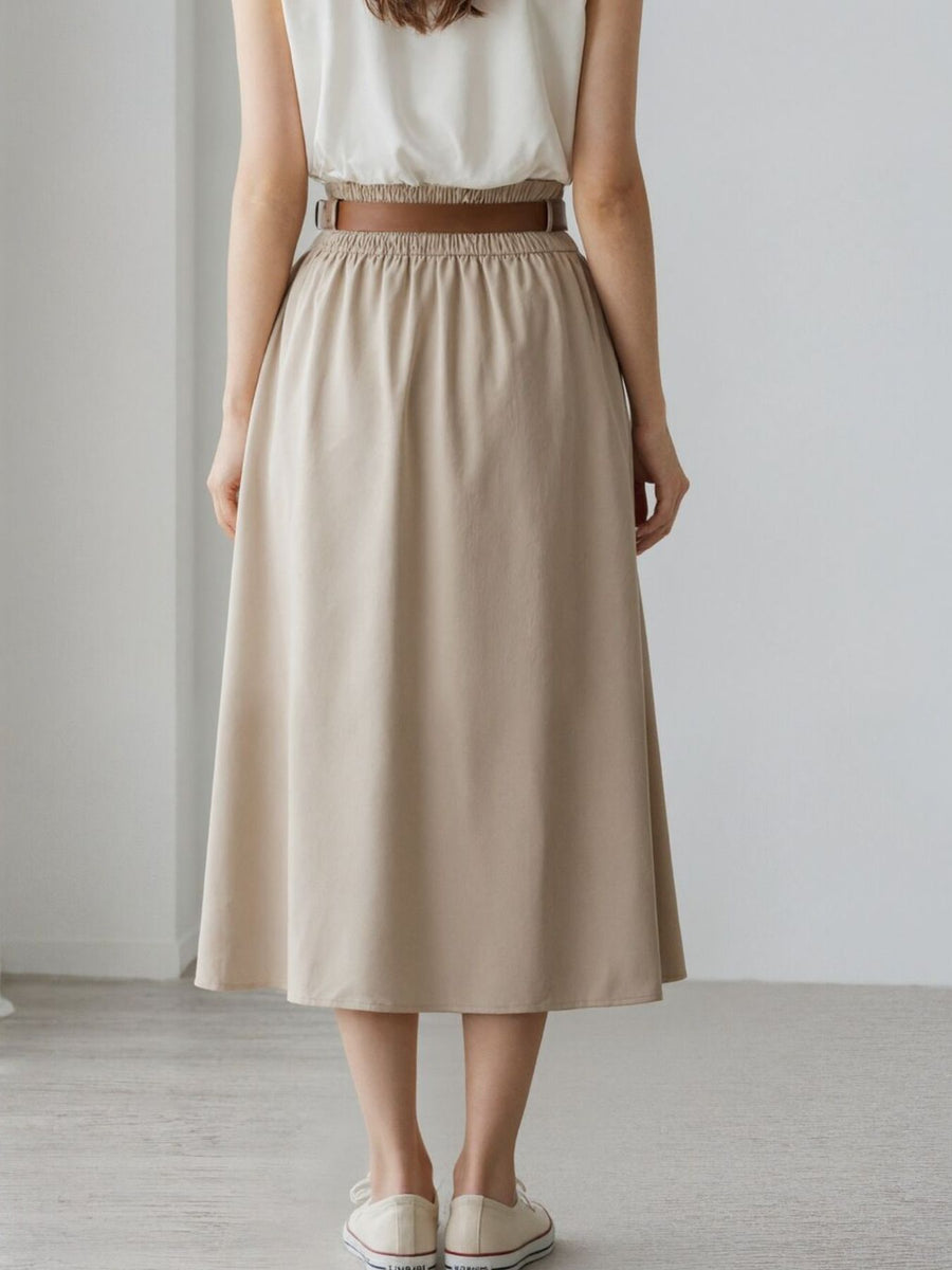 95% polyester, 5% spandex Care instructions: Machine wash cold midi skirt in Apricot with A-line silhouette