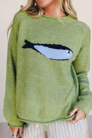 Green knit sweater with a blue and black fish graphic, crew neck, long sleeves.
